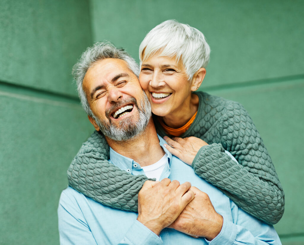 Happy active senior couple having fun outdoors